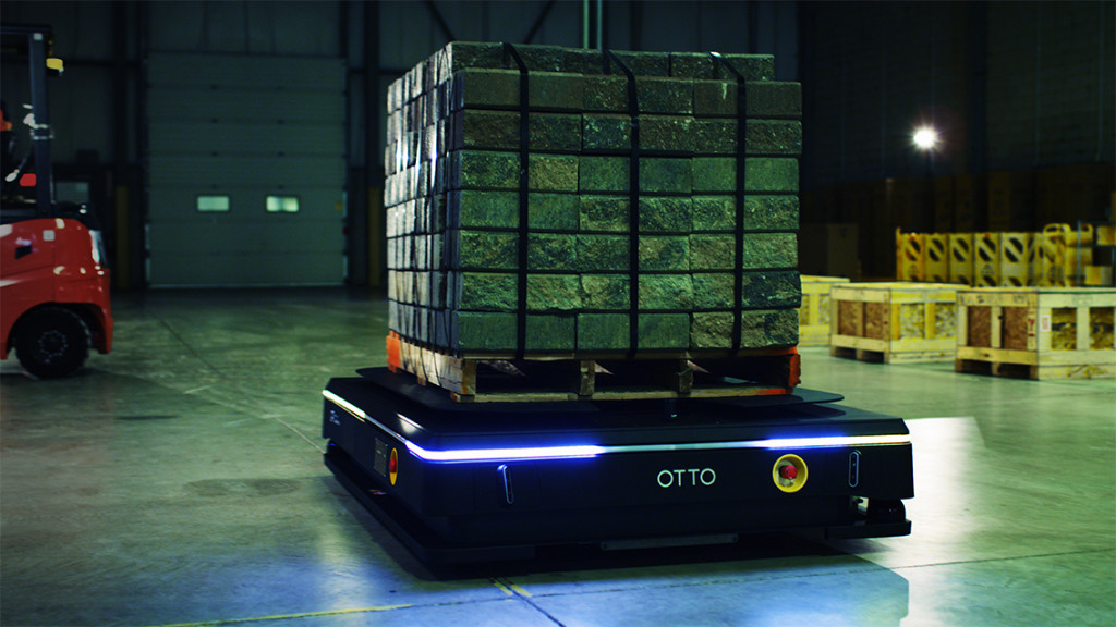 OTTO 1500 Autonomous Mobile Robot (AMR) moving pallets in a warehouse. An example of manufacturing automations and autonomous material handling.