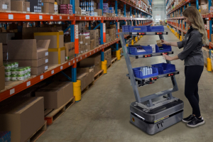 Light directed picking system being used in a warehouse. Pick to light system, and put to light system.